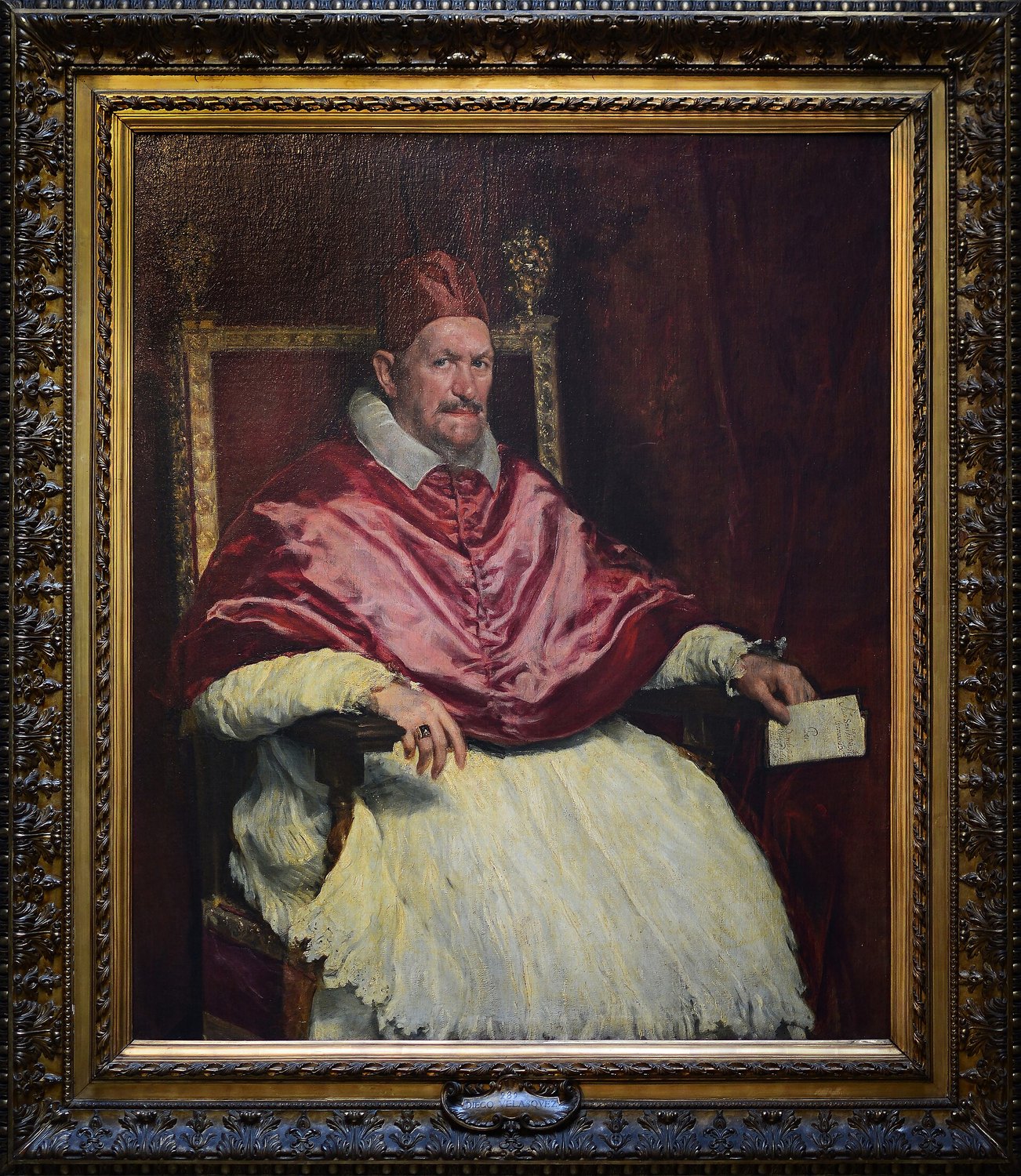 Velázquez’s Portrait of Innocent X at the Doria Pamphilj Gallery, the pope seated in his red mozzetta
